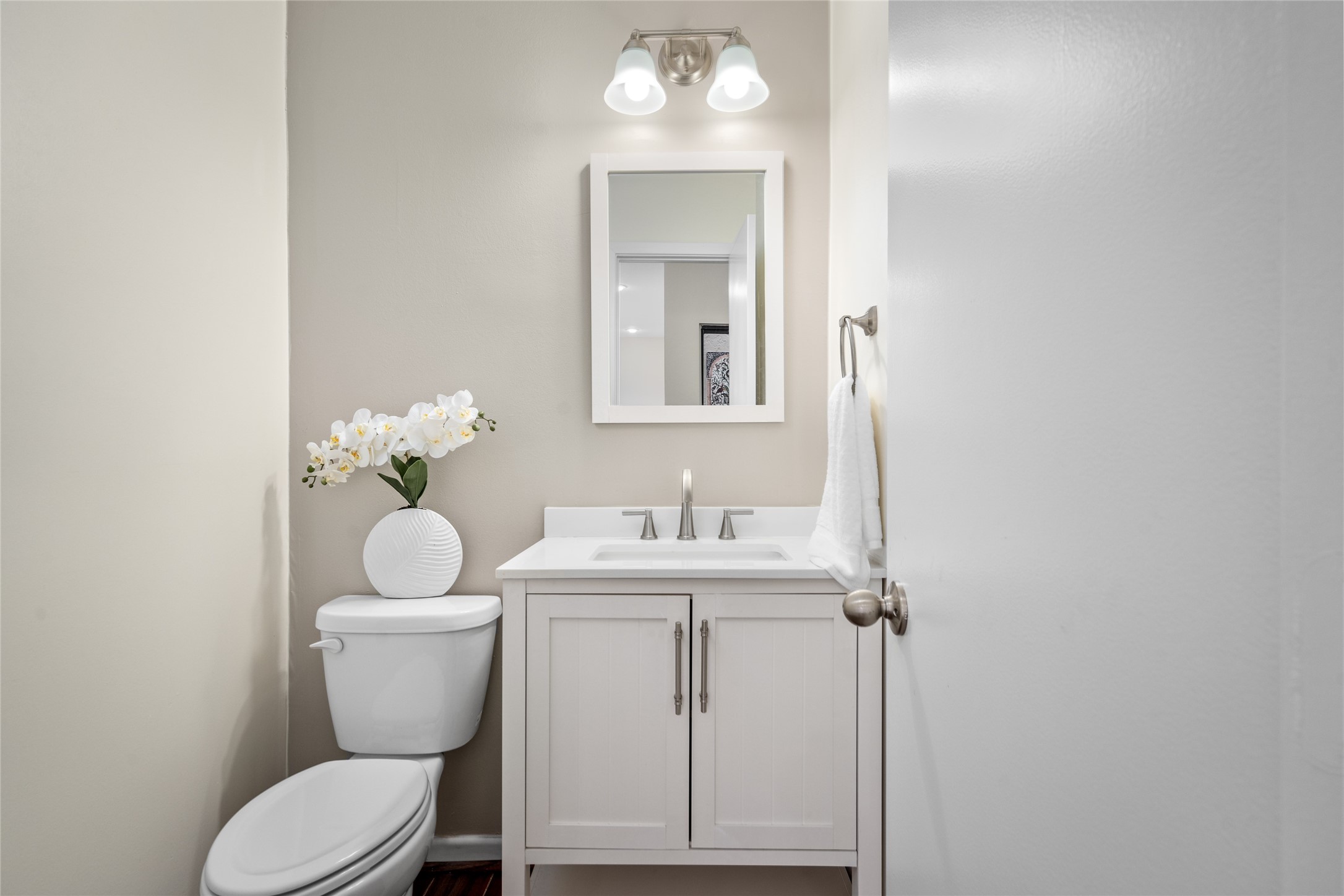 6728 Buffalo Speedway West University Place, TX 77005 - Photo 19 of 28 a bathroom with a toilet a sink and mirror