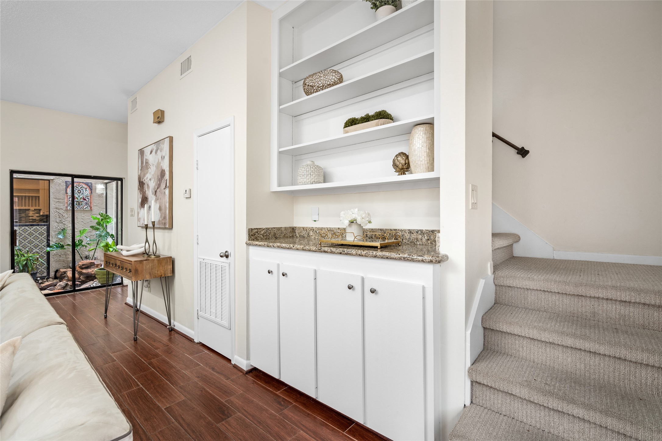 6728 Buffalo Speedway West University Place, TX 77005 - Photo 20 of 28 a hallway with white cabinets and wooden floor