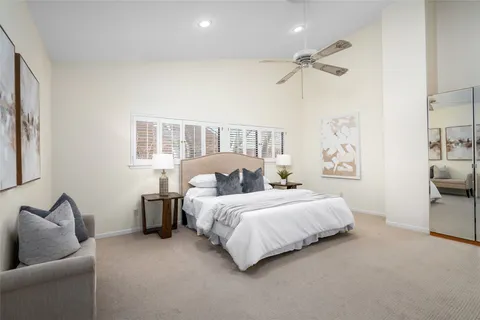 a bed room with a bed and a couch