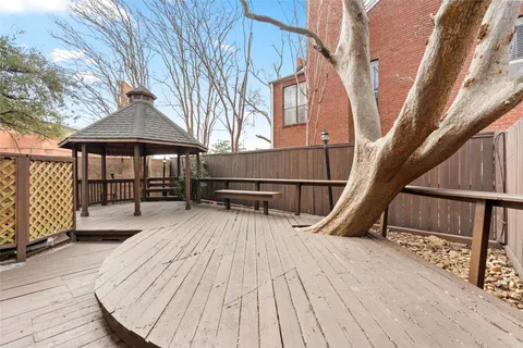a view of balcony with wooden floor and outdoor seating