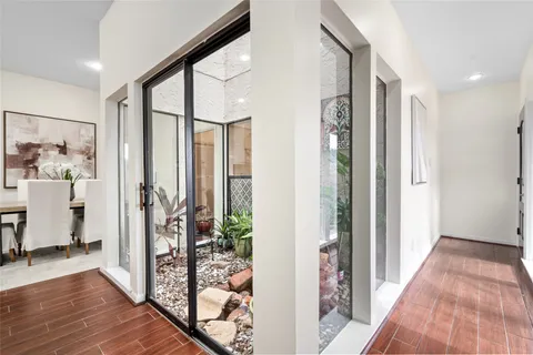 a view of entryway with livingroom and wooden floor