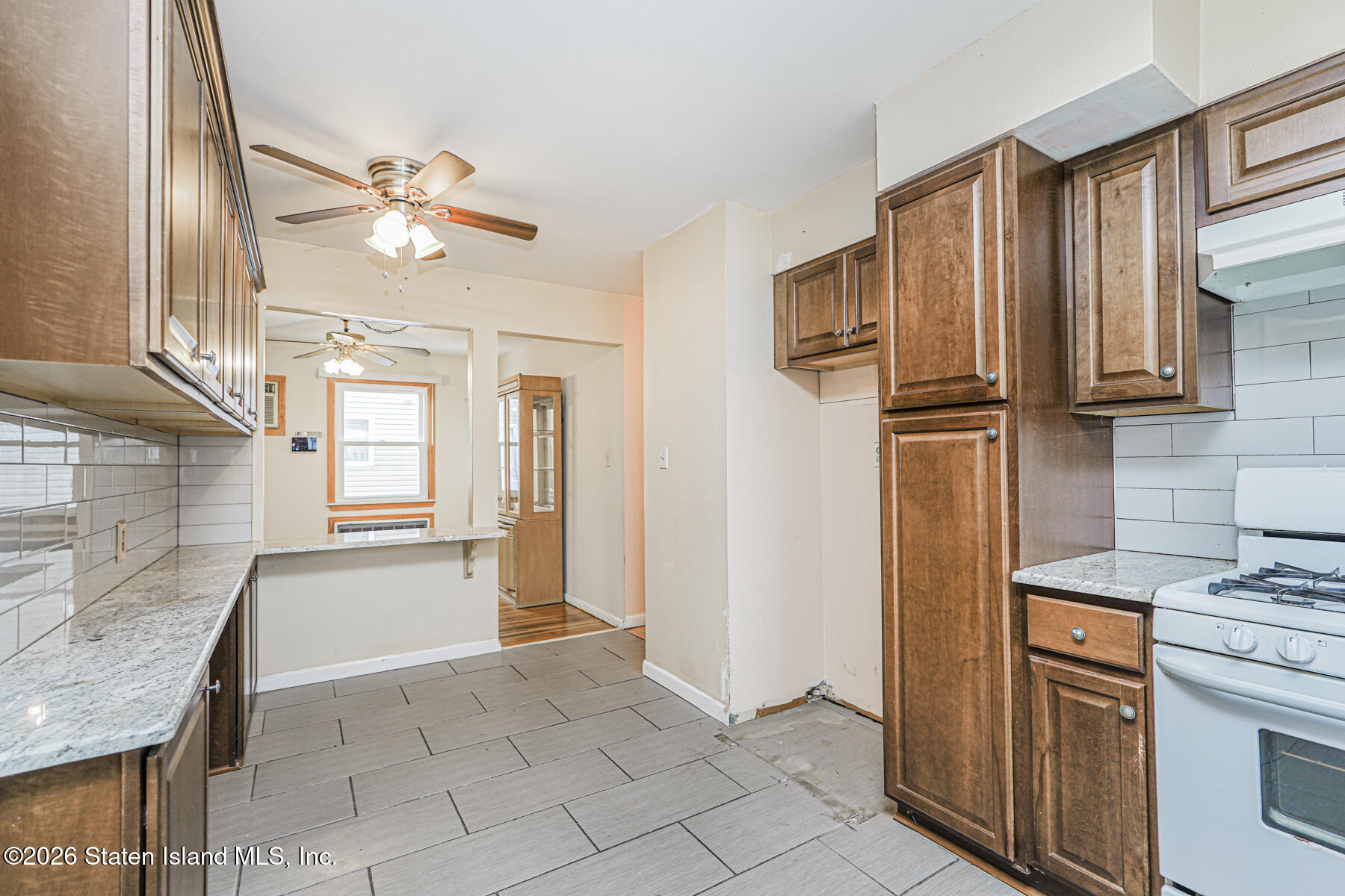 1 Fillat Street Staten Island, NY 10314 - Photo 14 of 39 a view of kitchen with windows cabinets and stainless steel appliances
