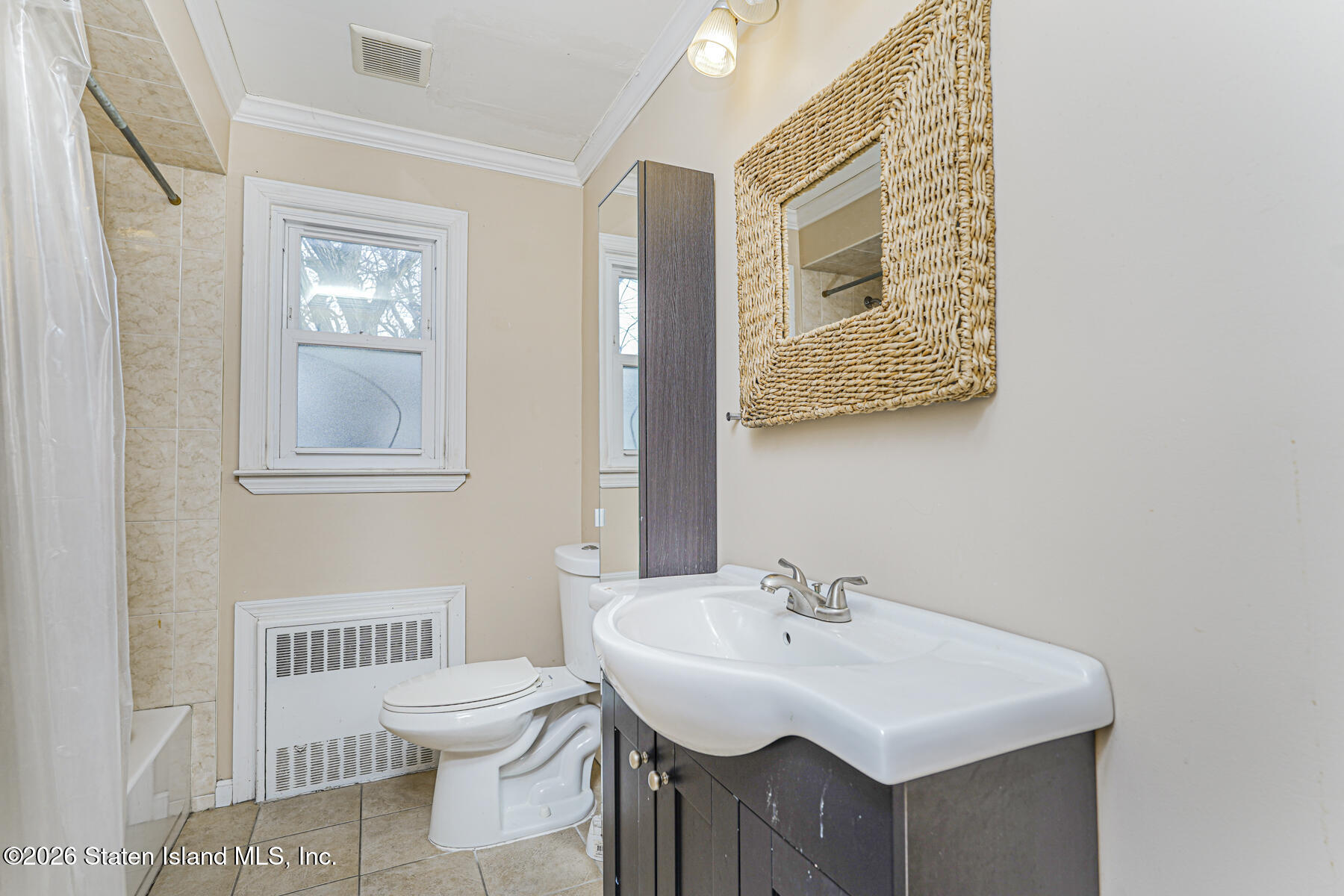 1 Fillat Street Staten Island, NY 10314 - Photo 20 of 39 a bathroom with a sink and a toilet