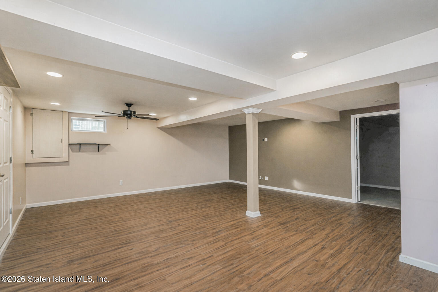 1 Fillat Street Staten Island, NY 10314 - Photo 21 of 39 an empty room with wooden floor and windows