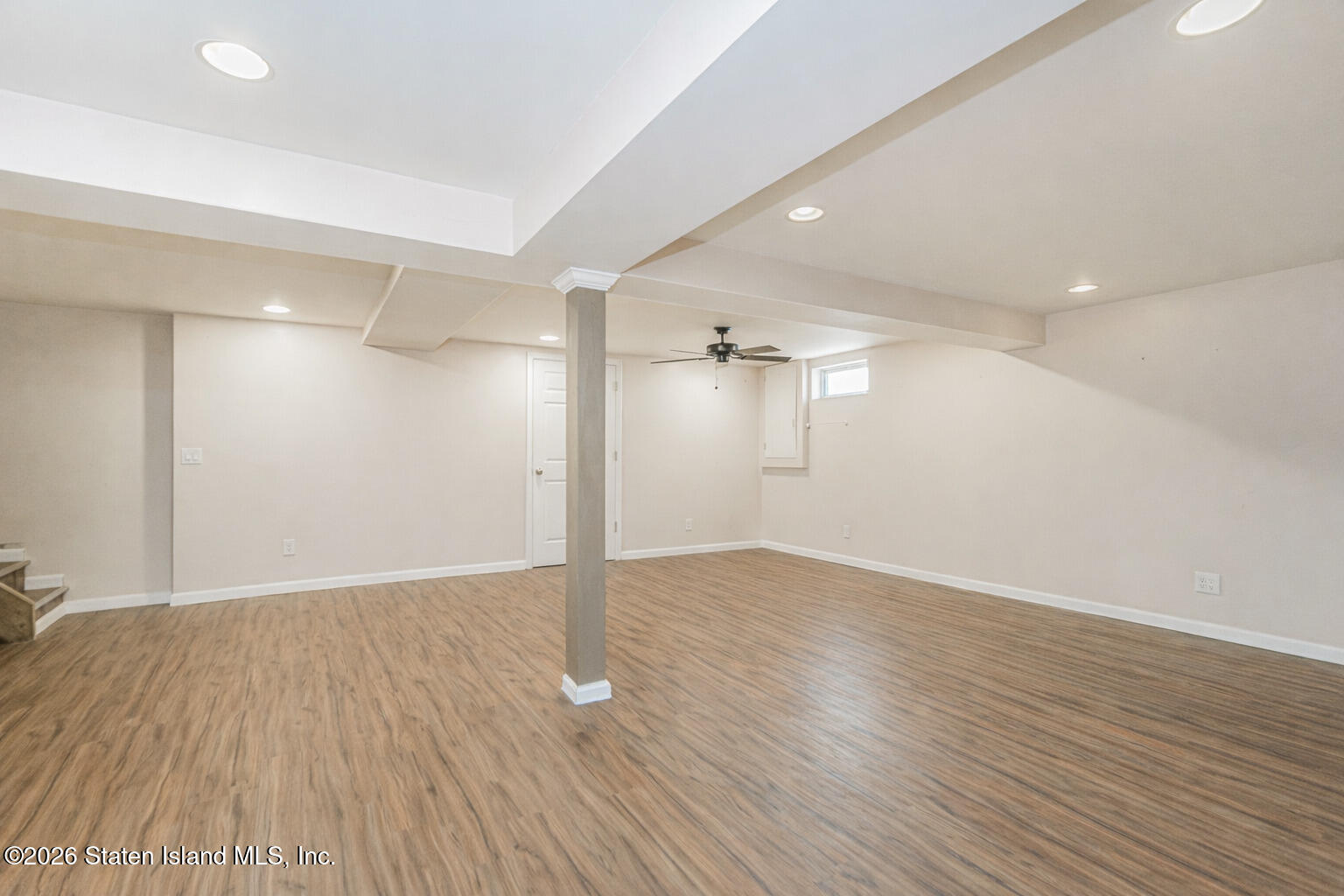 1 Fillat Street Staten Island, NY 10314 - Photo 22 of 39 an empty room with wooden floor and windows