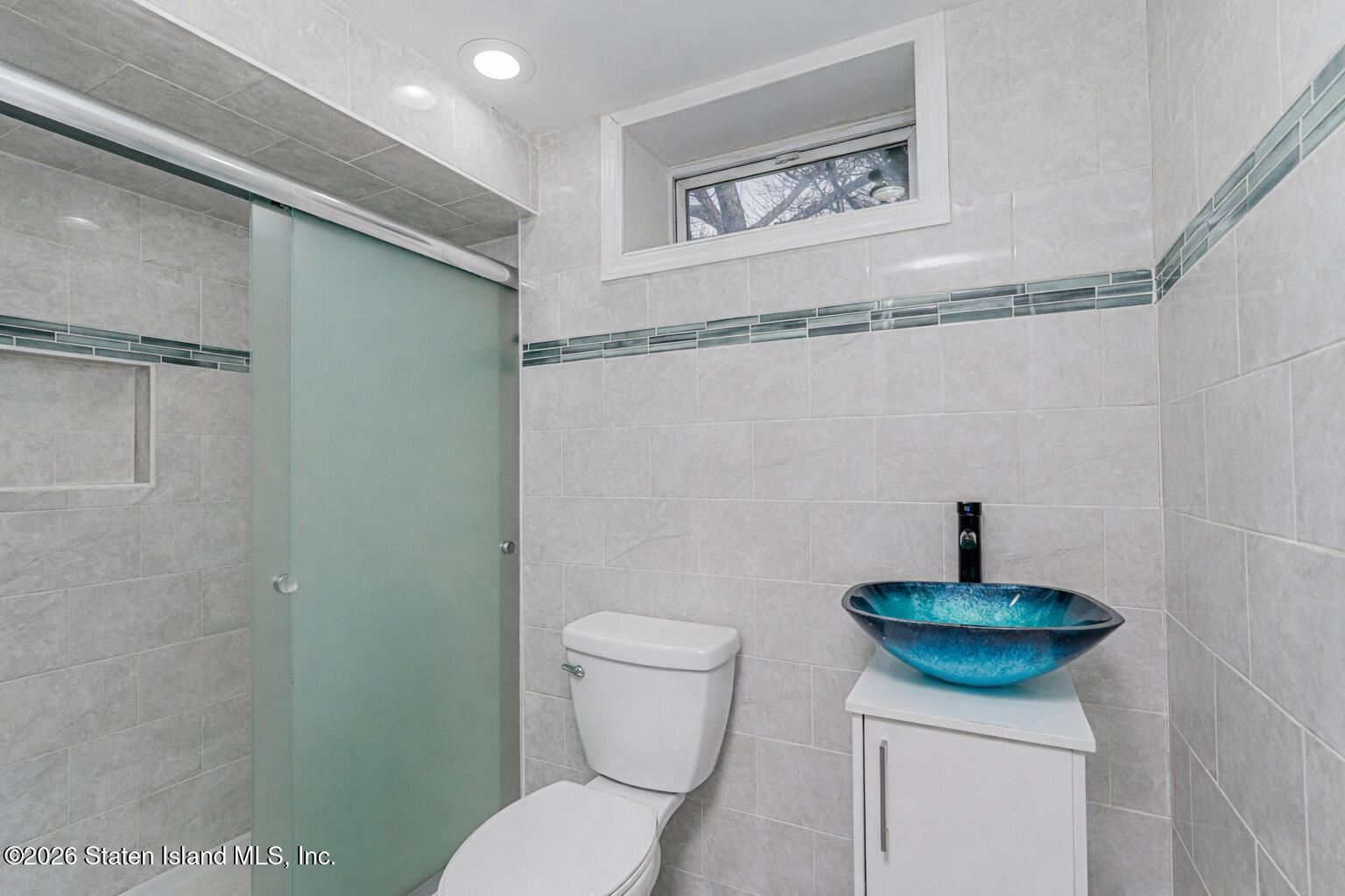 1 Fillat Street Staten Island, NY 10314 - Photo 23 of 39 a bathroom with a toilet and a sink