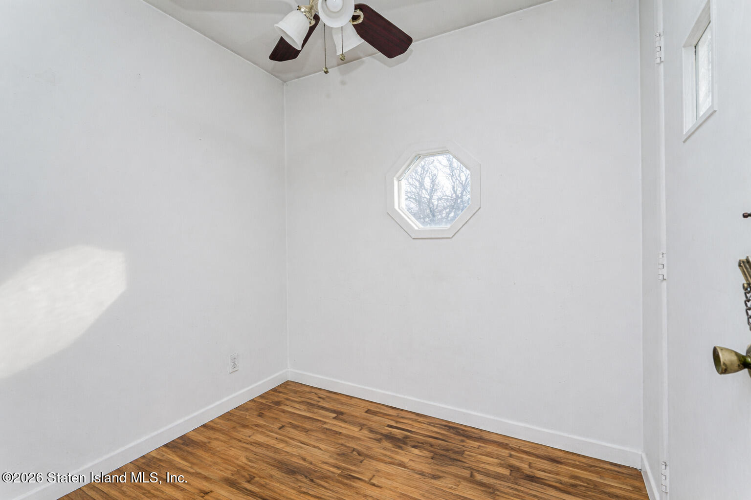 1 Fillat Street Staten Island, NY 10314 - Photo 24 of 39 a view of a room with wooden floor and ceiling fan