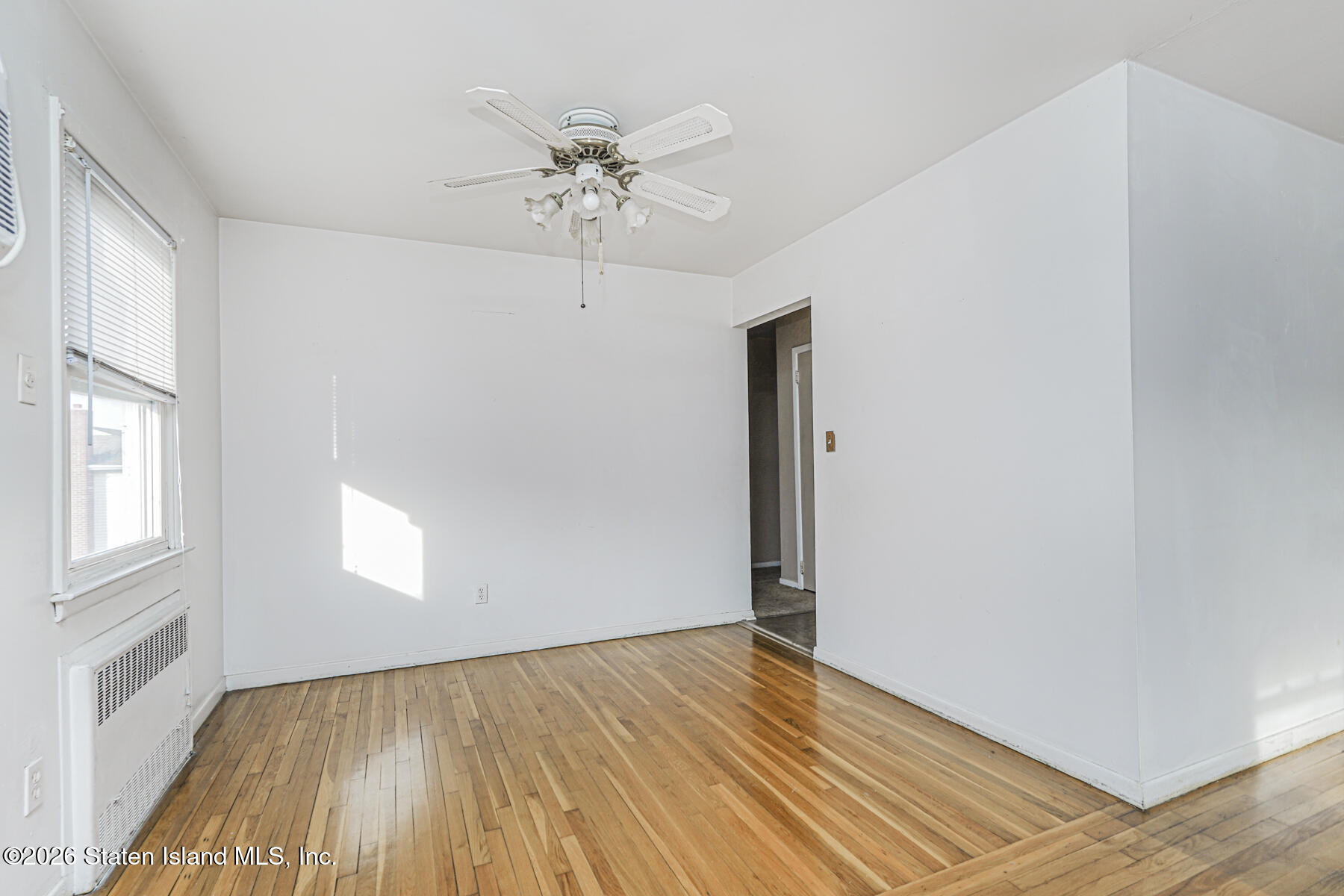 1 Fillat Street Staten Island, NY 10314 - Photo 28 of 39 an empty room with wooden floor and windows
