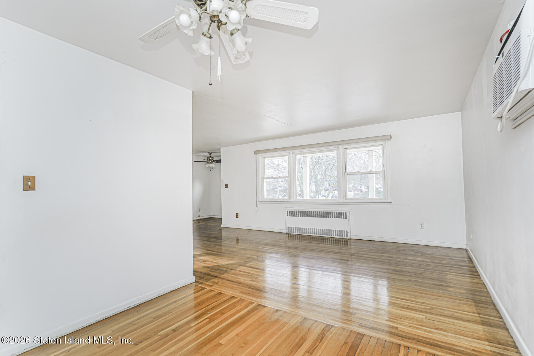 1 Fillat Street Staten Island, NY 10314 - Photo 29 of 39 a view of empty room with wooden floor and fan