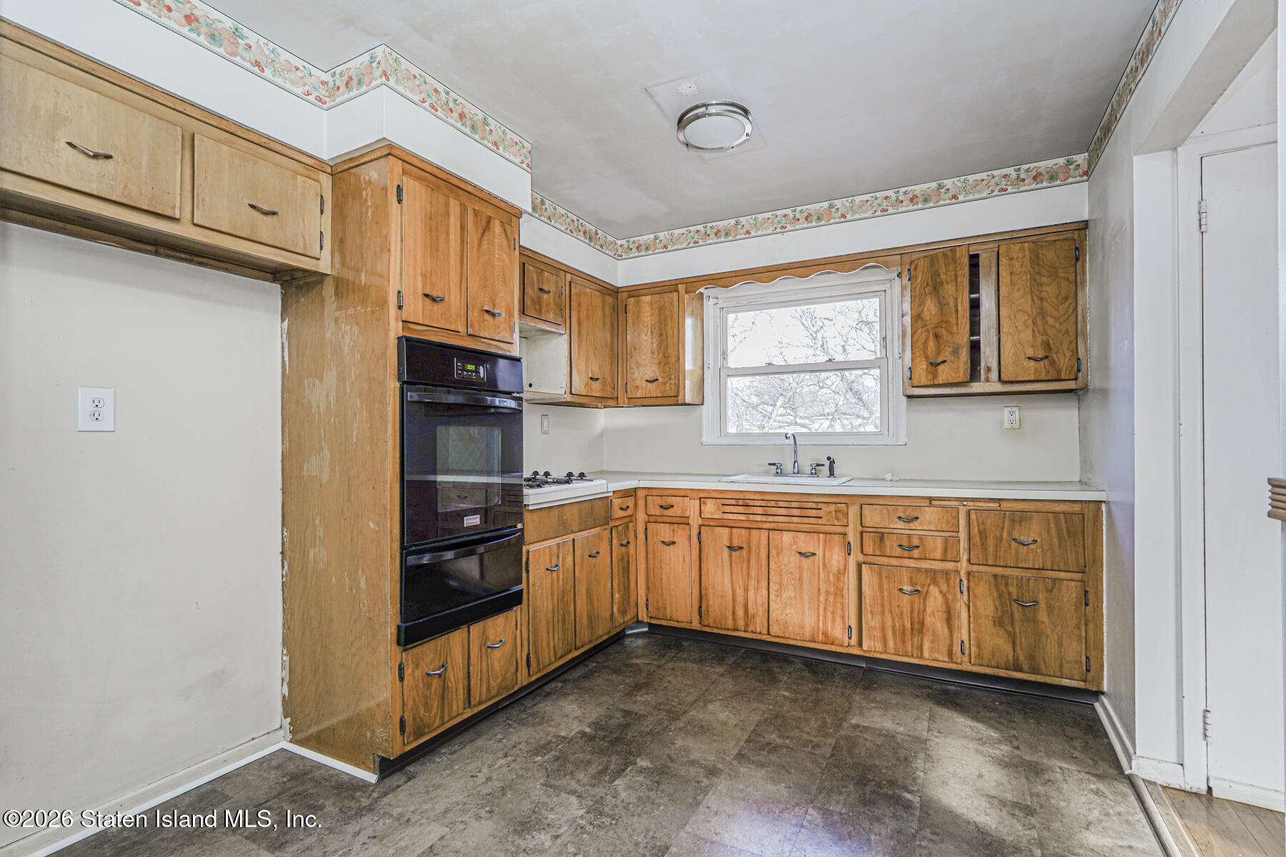 1 Fillat Street Staten Island, NY 10314 - Photo 31 of 39 a kitchen with stainless steel appliances granite countertop a stove a sink and a refrigerator