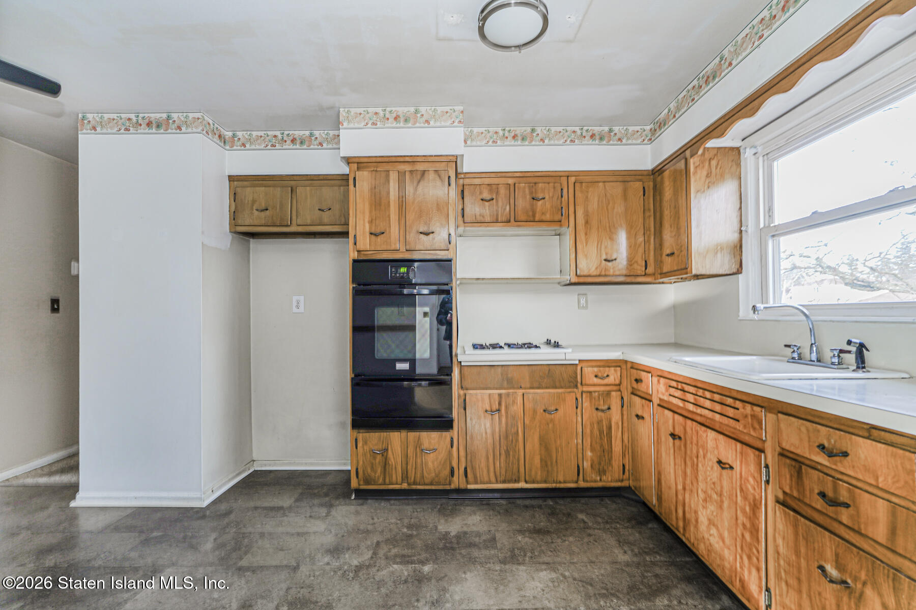 1 Fillat Street Staten Island, NY 10314 - Photo 32 of 39 a kitchen with stainless steel appliances cabinets and a window