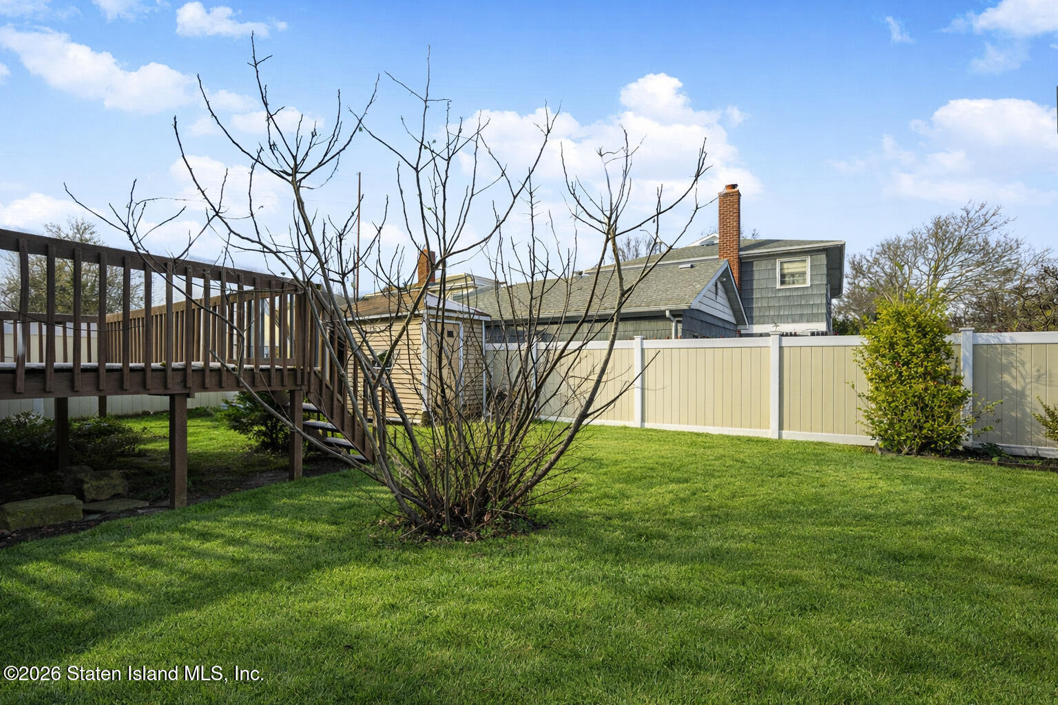 1 Fillat Street Staten Island, NY 10314 - Photo 38 of 39 a view of a yard with a house in the background