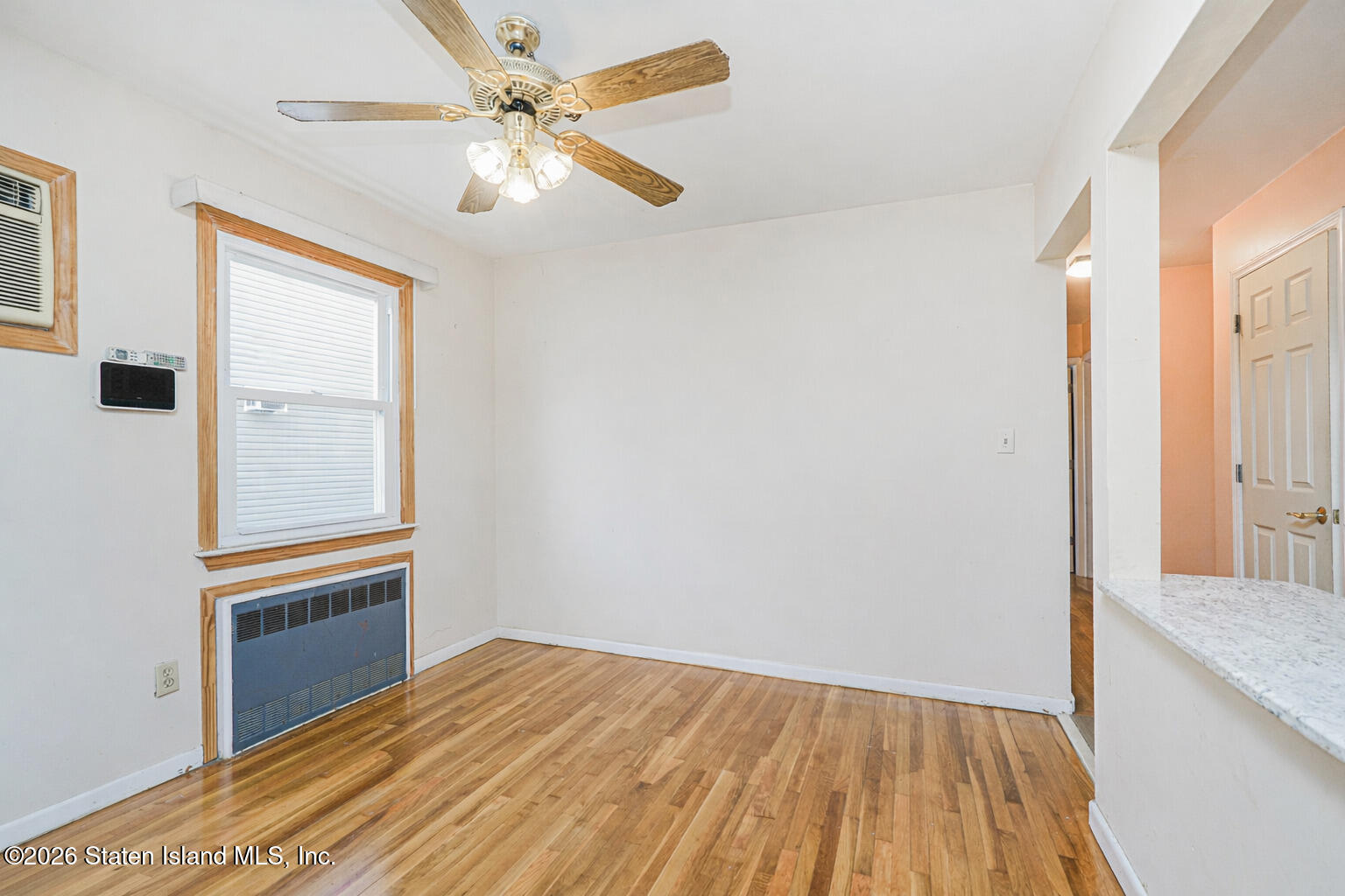1 Fillat Street Staten Island, NY 10314 - Photo 9 of 39 a view of empty room with wooden floor and fan