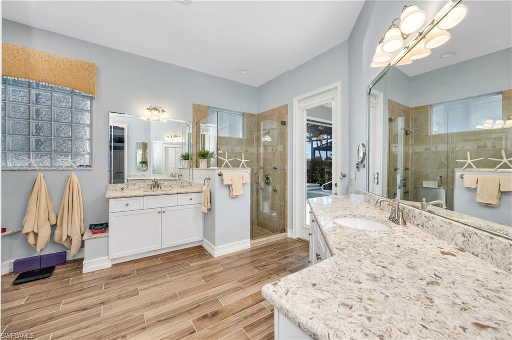 10318 Gator Bay Court Naples, FL 34120 - Photo 8 of 27 Fully remodeled Primary Bath with Changing/Exercise area. Doubles as the Cabana Bath