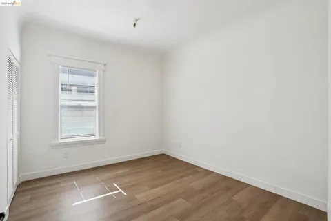 a kitchen with granite countertop white cabinets and sink