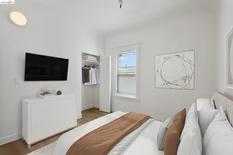 a kitchen with stainless steel appliances granite countertop white cabinets sink and a granite counter top