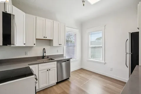 a view of a hallway with washer and dryer