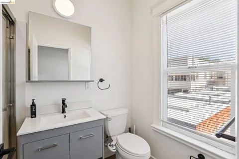 a large kitchen with cabinets appliances and a counter space
