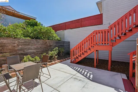 a kitchen with a stove a refrigerator and a microwave