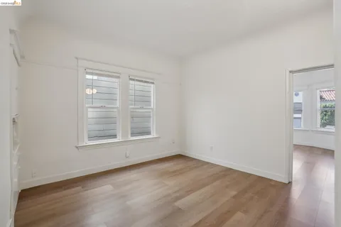 a bathroom with a toilet sink vanity and mirror