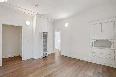 a bathroom with a toilet sink vanity and shower