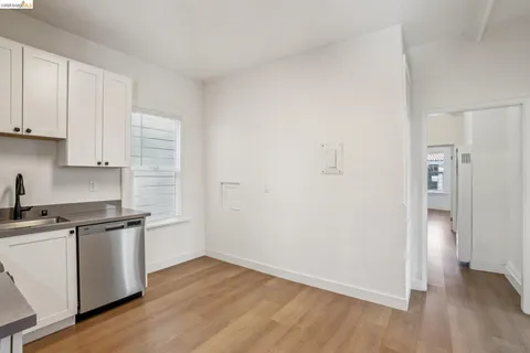 a bedroom with furniture and a wooden floor