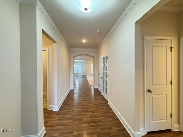 a view of a hallway with the wooden floor