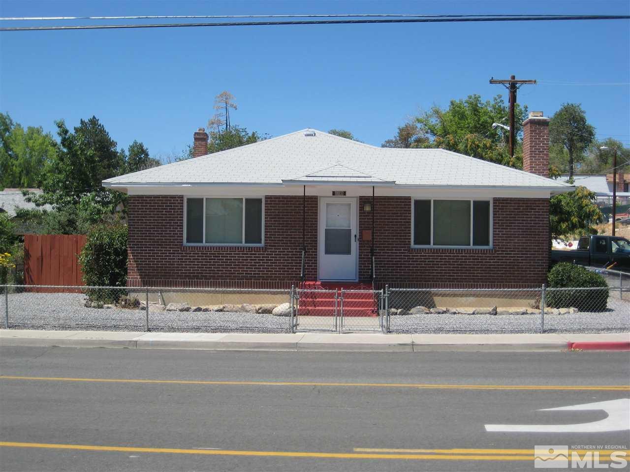 1195 Valley Road Reno, NV 89512 - Photo 1 of 1 a view of street along with house and trees