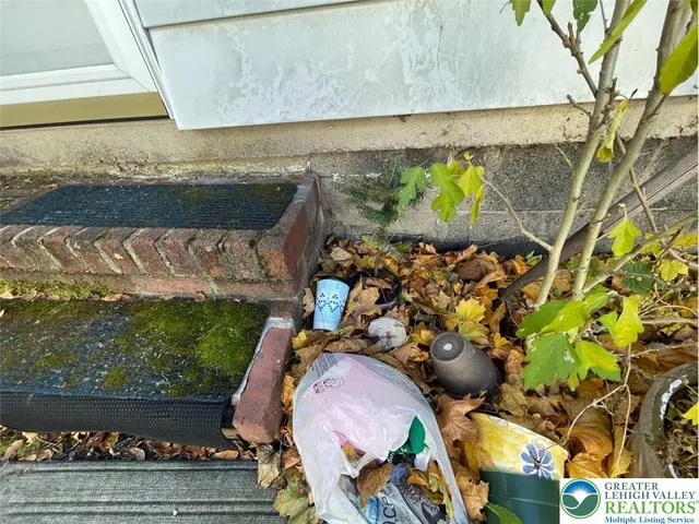 a living room with lots of furniture and a chandelier