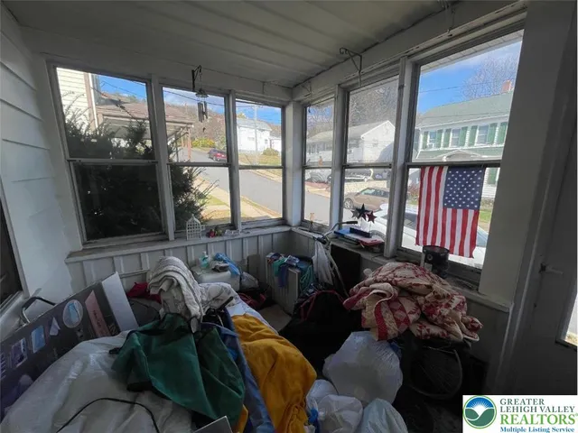 a living room with furniture and a table