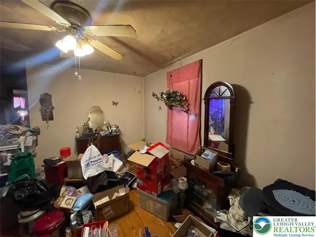 a bedroom with a bed and a bathroom