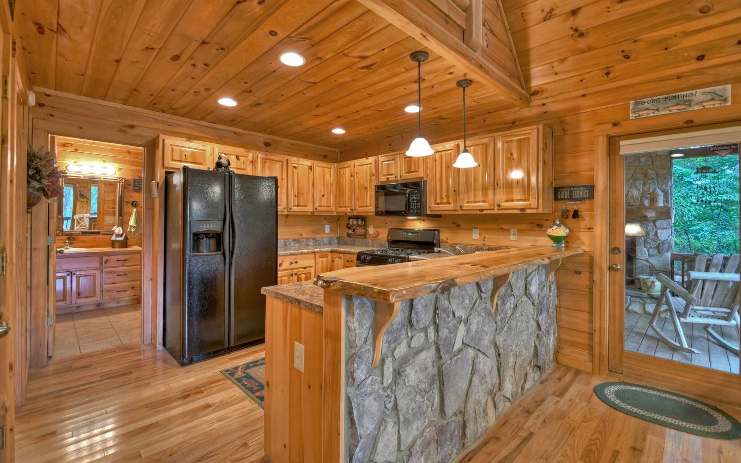 124 White Tail Ridge Blue Ridge, GA 30513 - Photo 14 of 42 a view of a refrigerator in kitchen and wooden floor