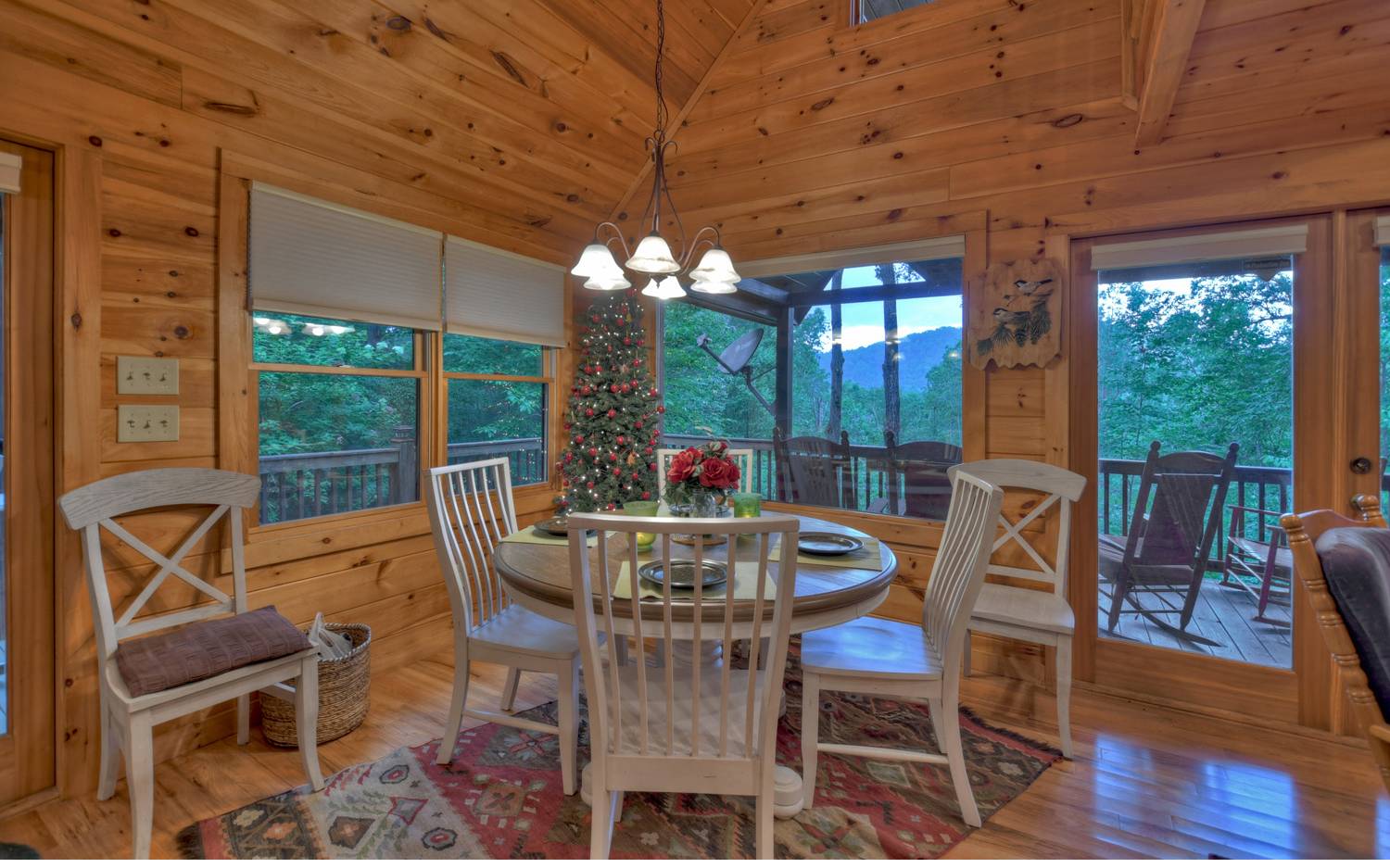 124 White Tail Ridge Blue Ridge, GA 30513 - Photo 21 of 42 a view of a dining room with furniture wooden floor and chandelier