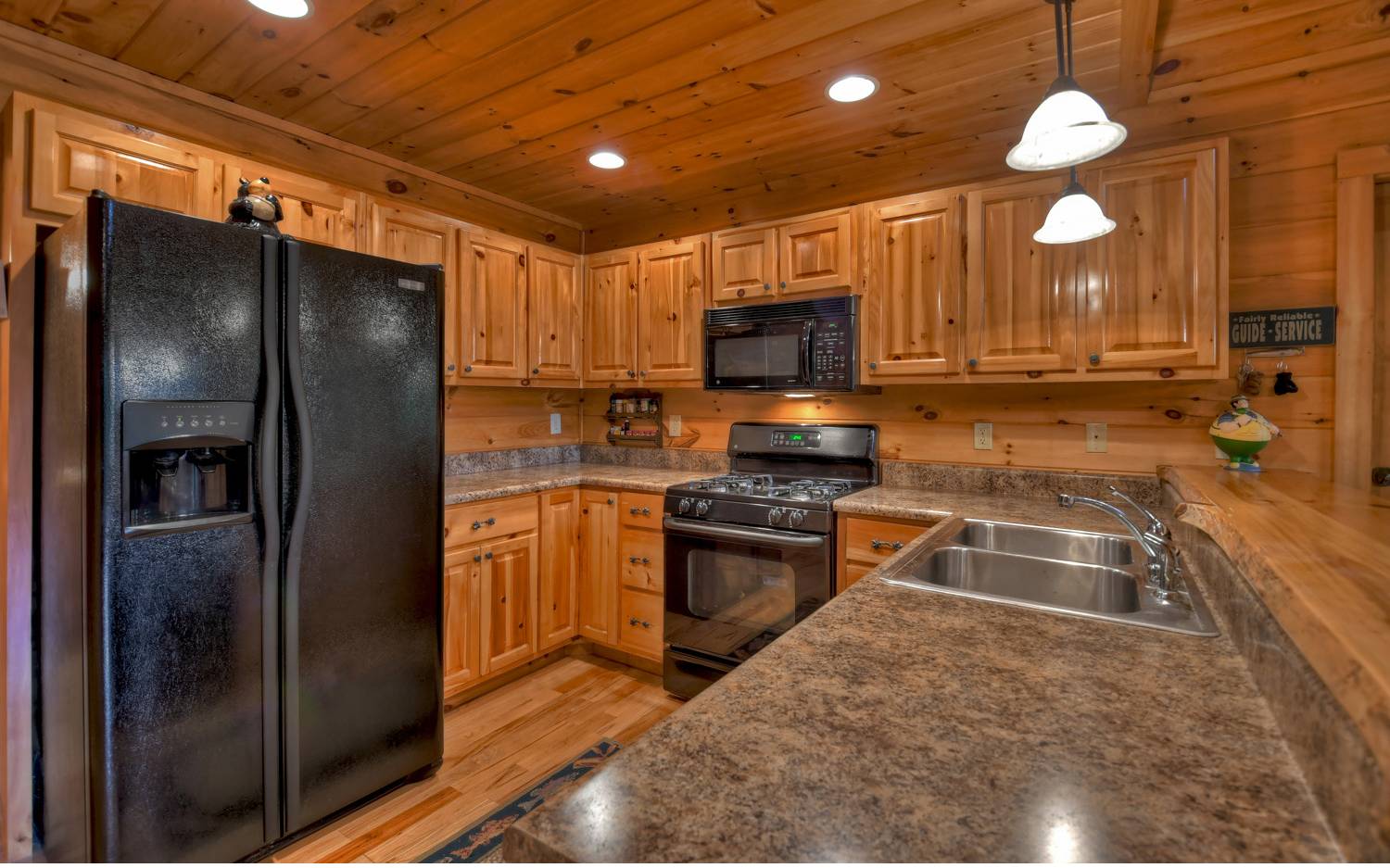 124 White Tail Ridge Blue Ridge, GA 30513 - Photo 25 of 42 a kitchen with stainless steel appliances granite countertop a refrigerator a stove a sink and a microwave