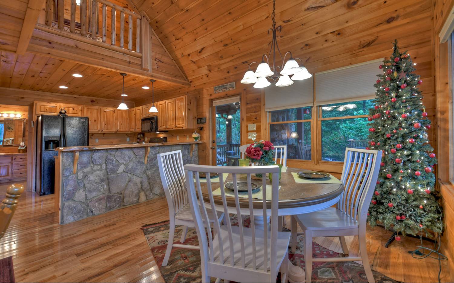 124 White Tail Ridge Blue Ridge, GA 30513 - Photo 5 of 42 a view of a dining room with furniture a chandelier and wooden floor