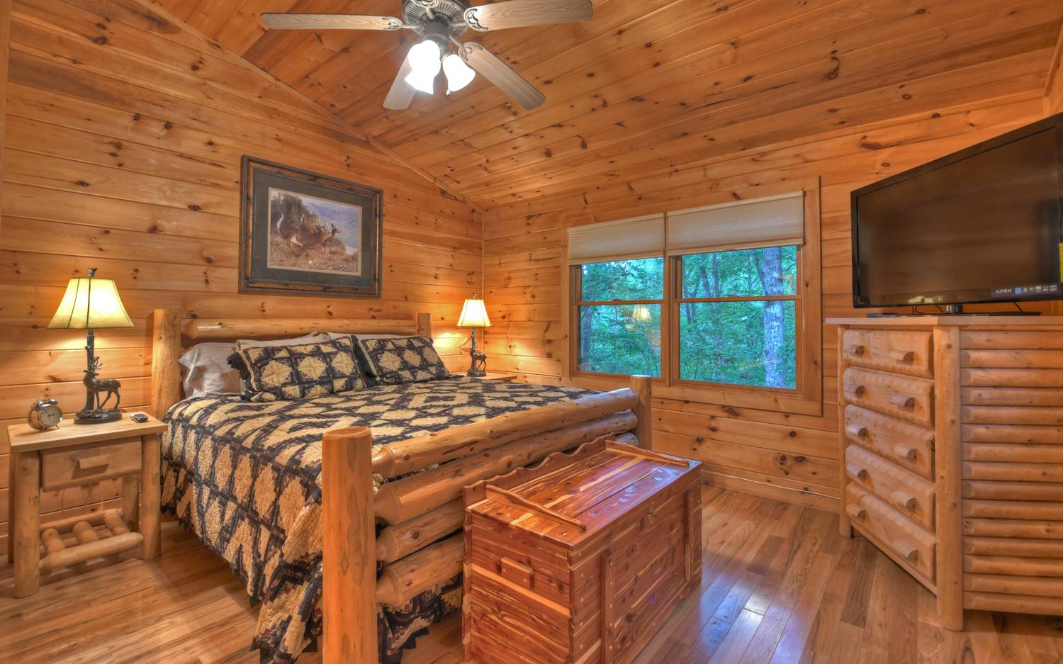 124 White Tail Ridge Blue Ridge, GA 30513 - Photo 10 of 42 a bedroom with a bed and a flat screen tv