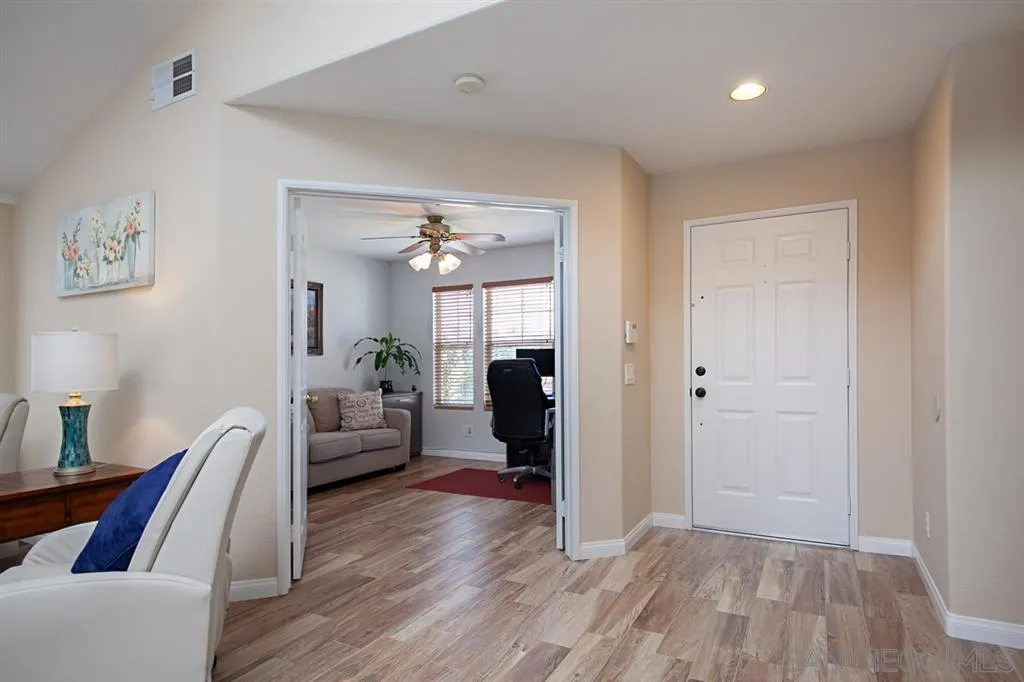 2170 Boulders Road Alpine, CA 91901 - Photo 11 of 24 a view of a livingroom with furniture and wooden floor