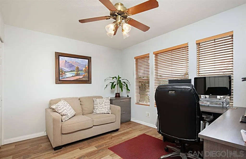 2170 Boulders Road Alpine, CA 91901 - Photo 12 of 24 a view of a livingroom with workspace and a couch