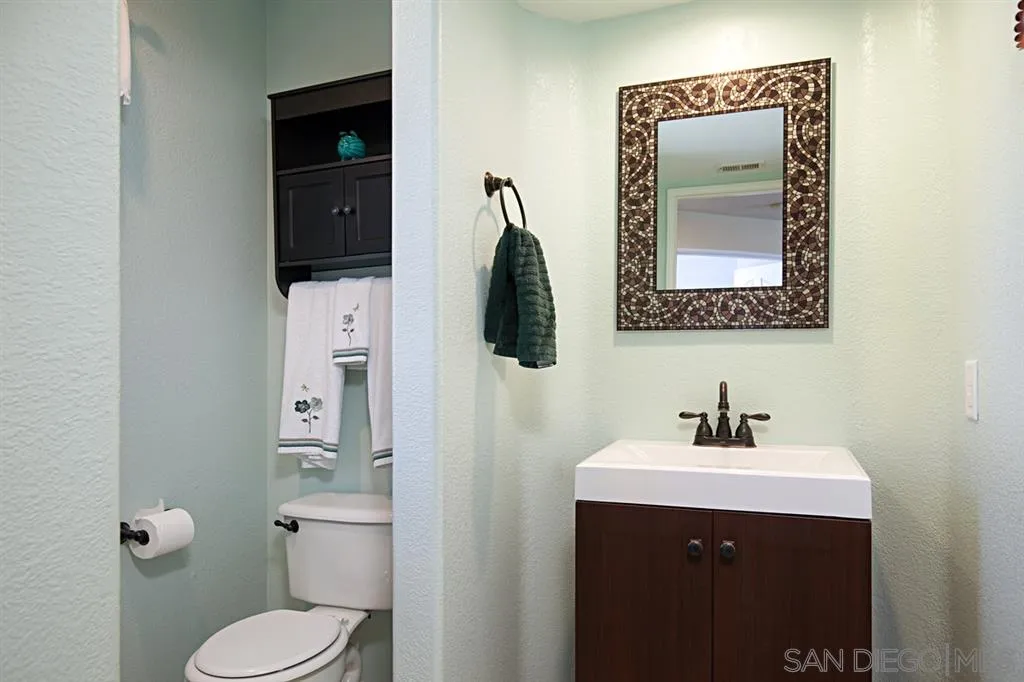 2170 Boulders Road Alpine, CA 91901 - Photo 13 of 24 a bathroom with a toilet sink and mirror