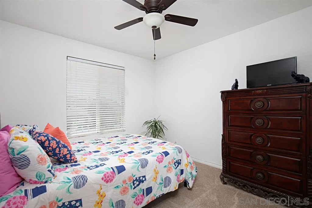 2170 Boulders Road Alpine, CA 91901 - Photo 20 of 24 a bedroom with a bed and a flat screen tv