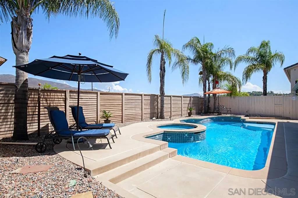 2170 Boulders Road Alpine, CA 91901 - Photo 2 of 24 a swimming pool with outdoor seating