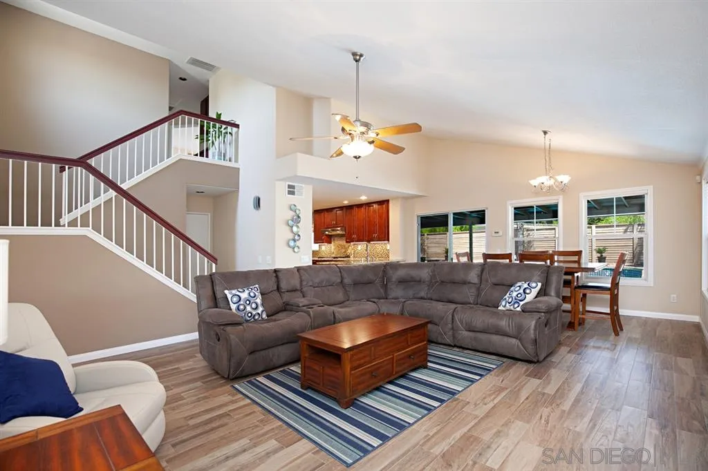 2170 Boulders Road Alpine, CA 91901 - Photo 7 of 24 a living room with furniture and a wooden floor