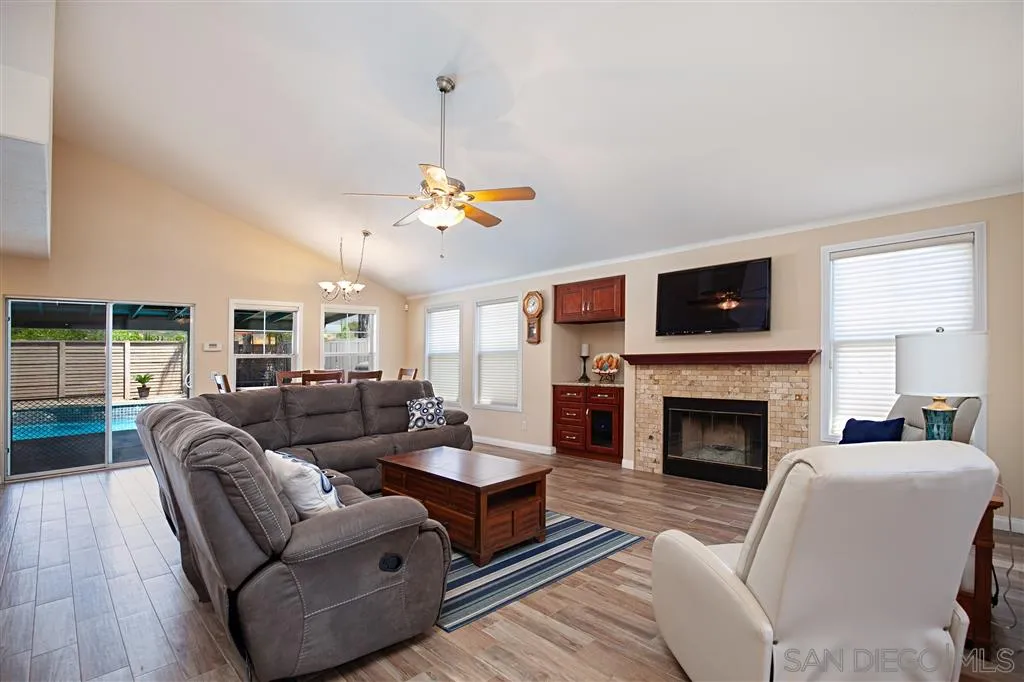2170 Boulders Road Alpine, CA 91901 - Photo 9 of 24 a living room with furniture and a fireplace