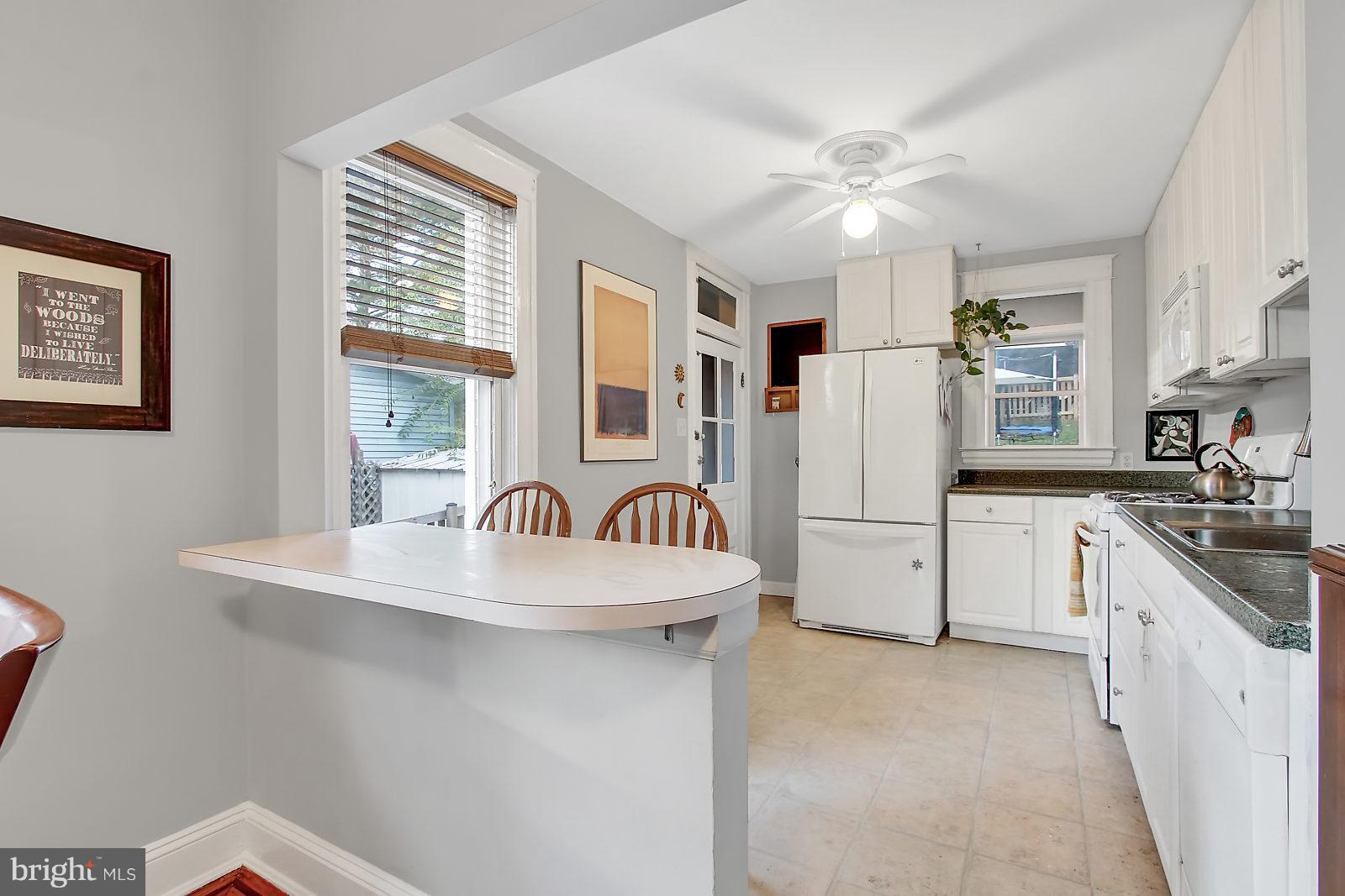 1104 Overbrook Road Baltimore, MD 21239 - Photo 6 of 28 Classic white cabinets and tile floors