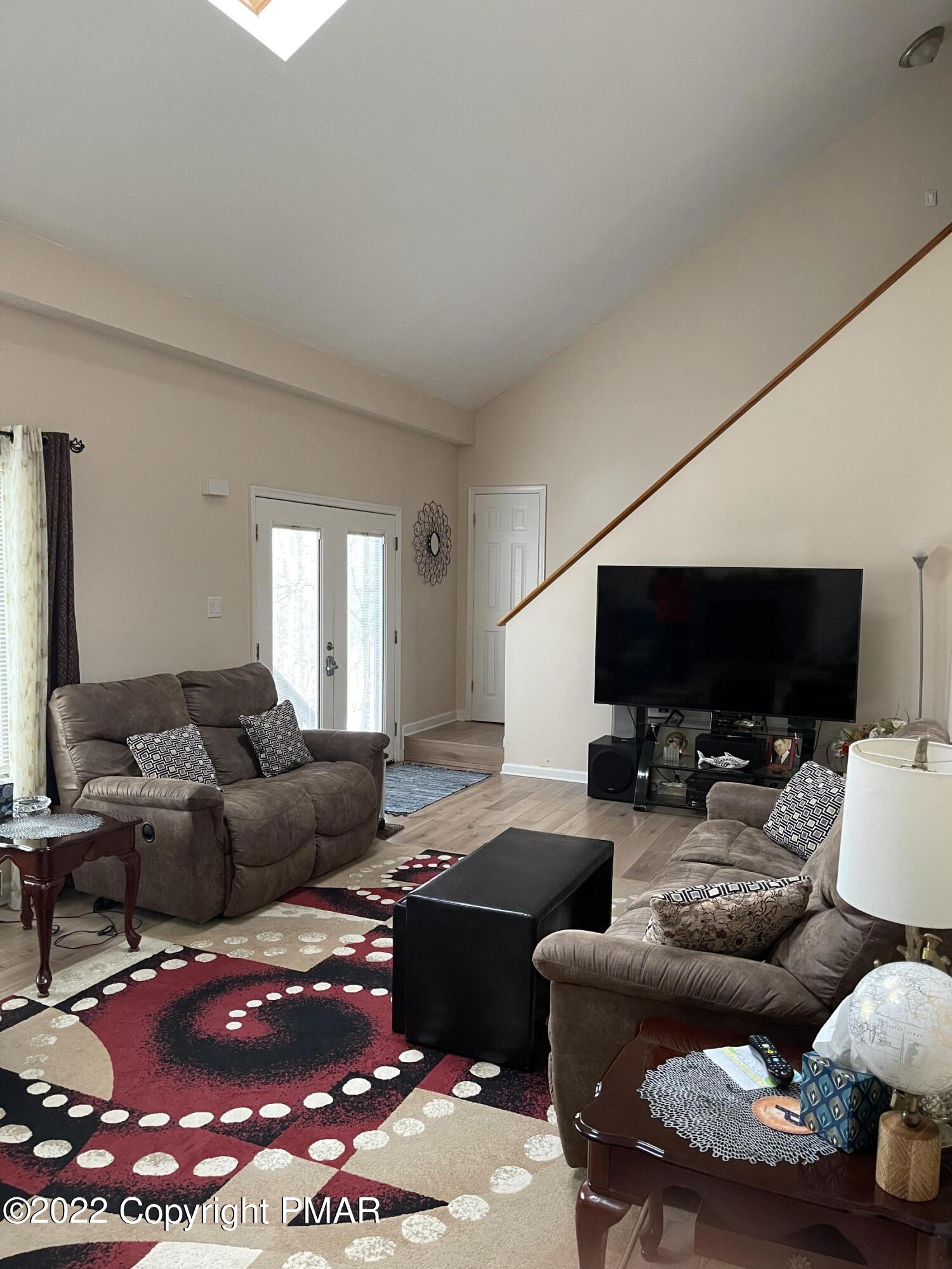 5665 Decker Road Bushkill, PA 18324 - Photo 12 of 32 a living room with furniture and a flat screen tv