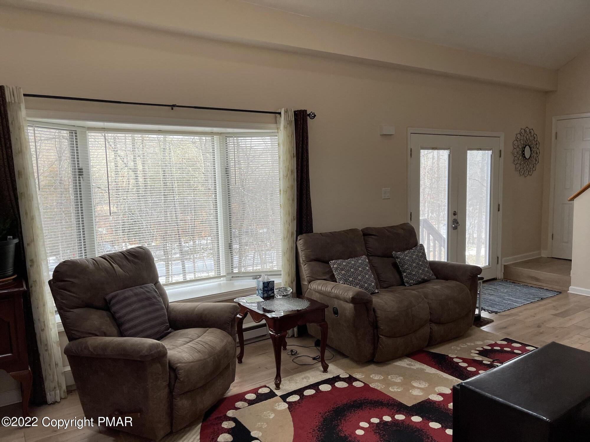 5665 Decker Road Bushkill, PA 18324 - Photo 13 of 32 a living room with furniture and a large window