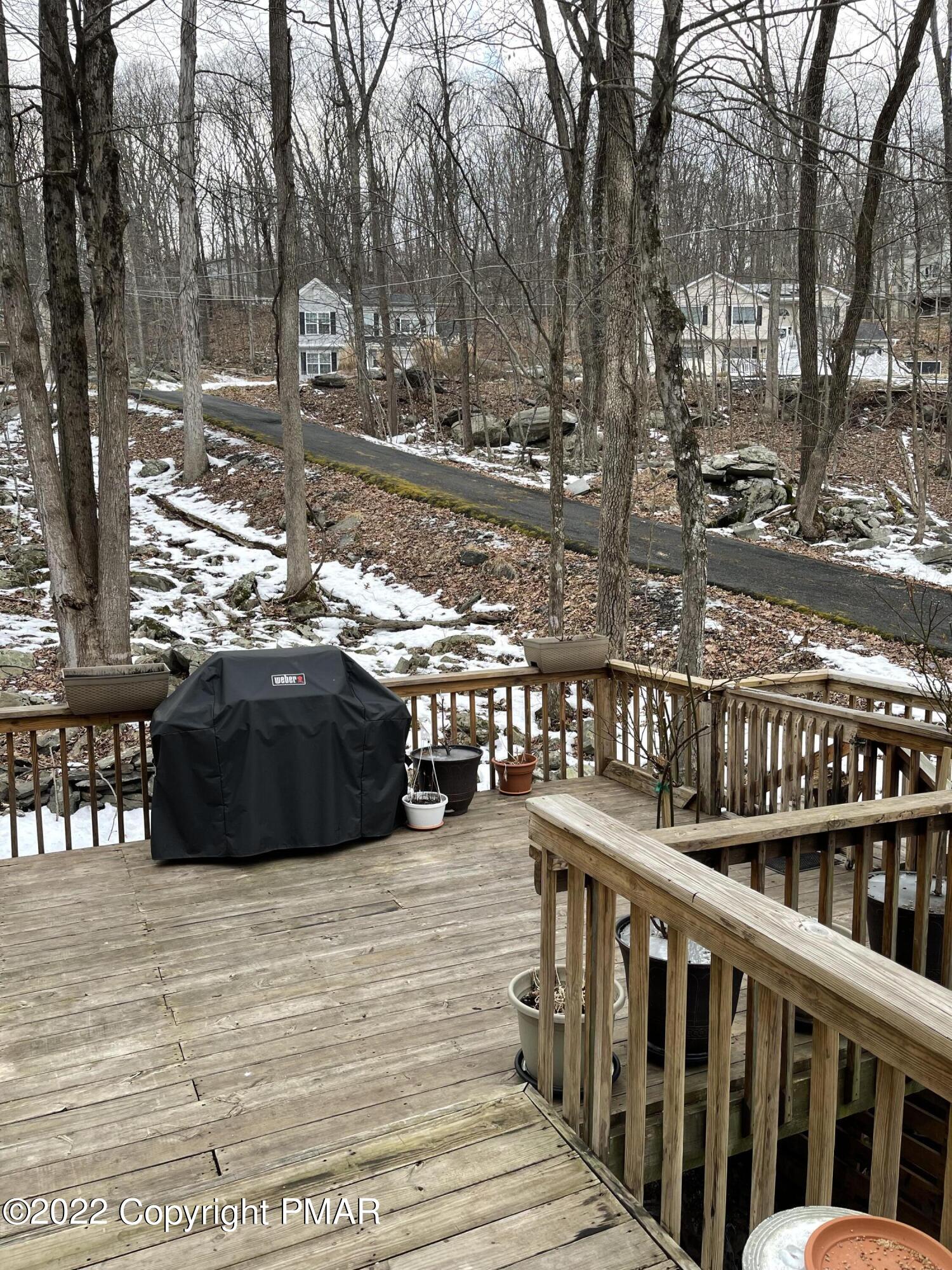 5665 Decker Road Bushkill, PA 18324 - Photo 2 of 32 a view of a balcony and car parked