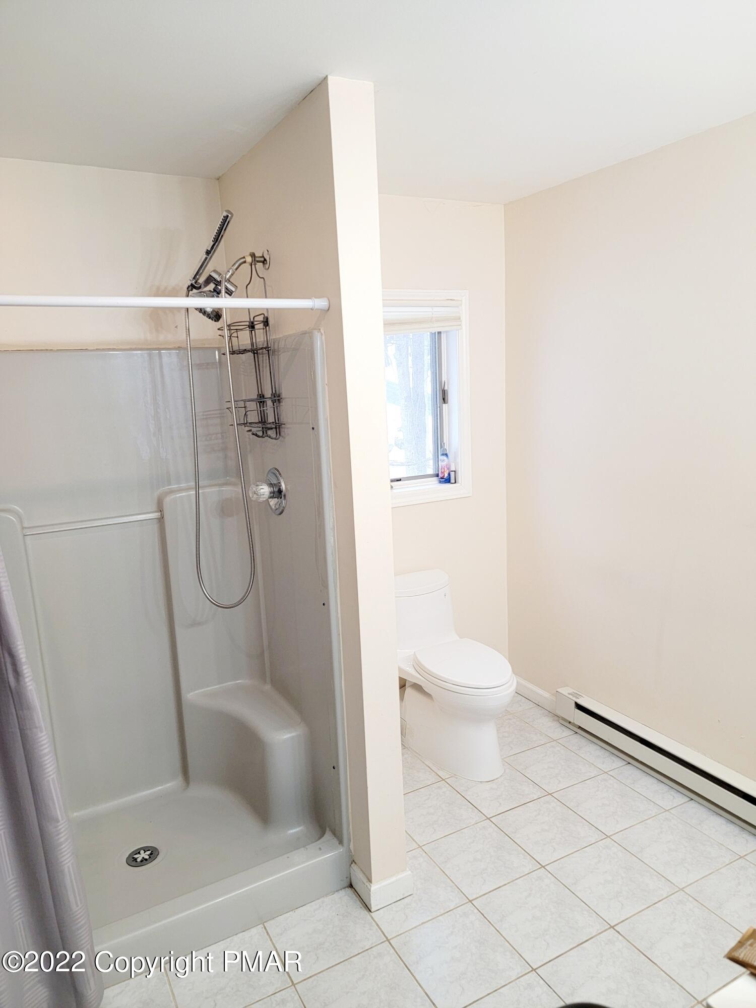 5665 Decker Road Bushkill, PA 18324 - Photo 25 of 32 a bathroom with a toilet and a shower