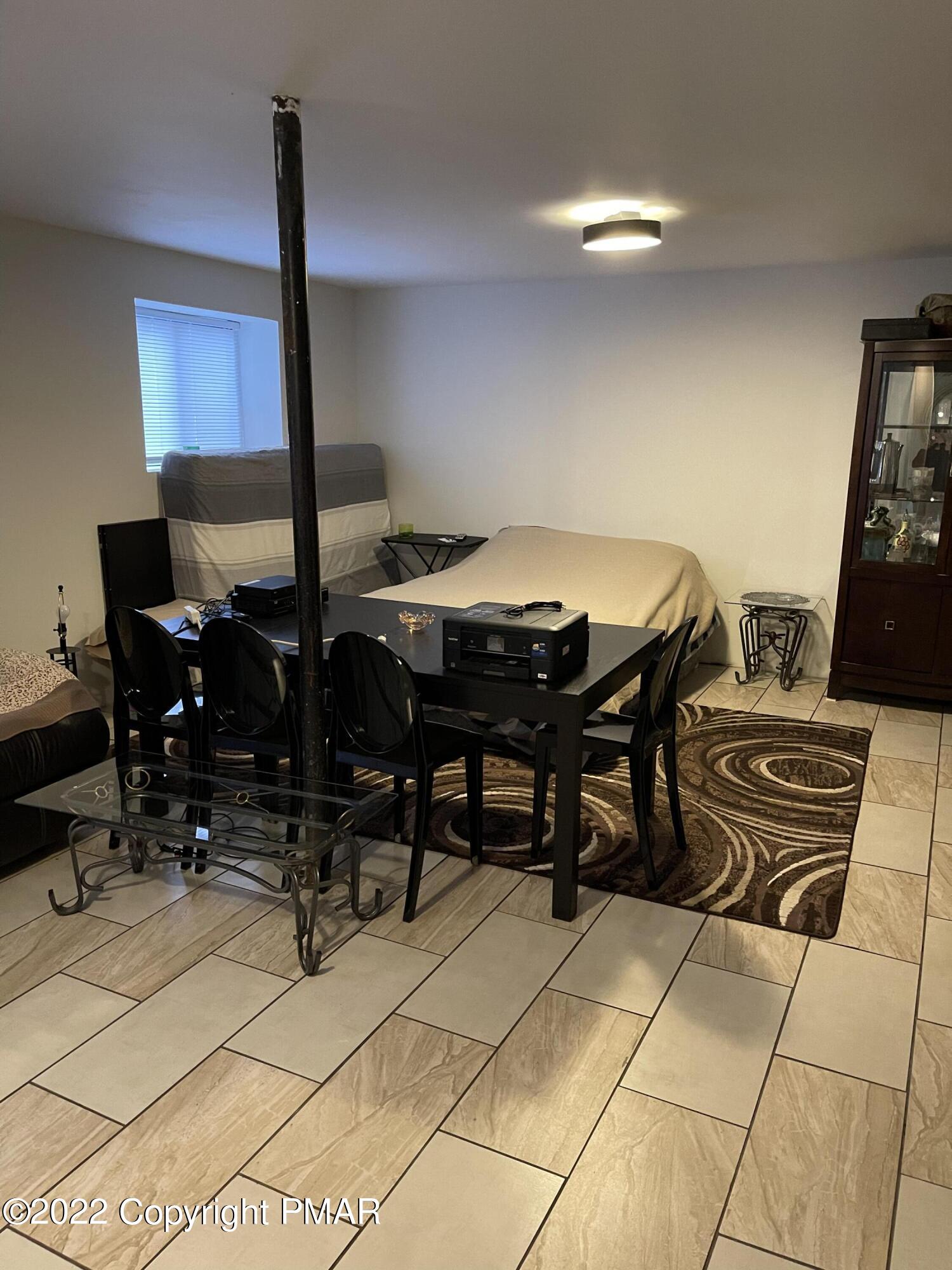 5665 Decker Road Bushkill, PA 18324 - Photo 27 of 32 a dinning table and chairs in a room