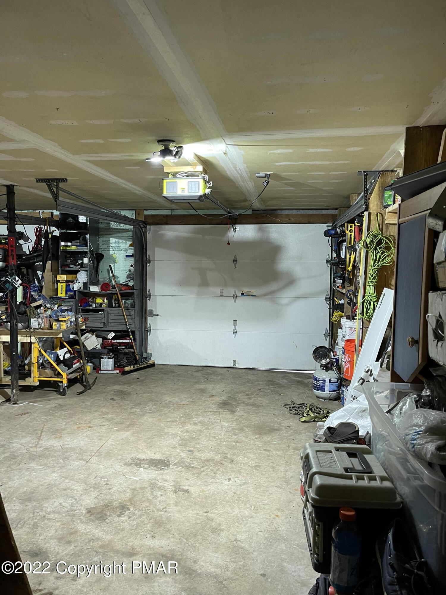5665 Decker Road Bushkill, PA 18324 - Photo 29 of 32 a view of a garage with a bike and car